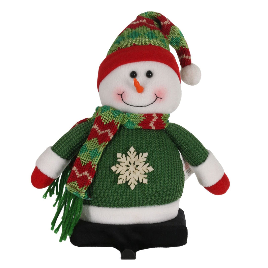 front view of snowman stocking holder wearing green waffle jumper and red and green knit hat and scarf with black metal hook