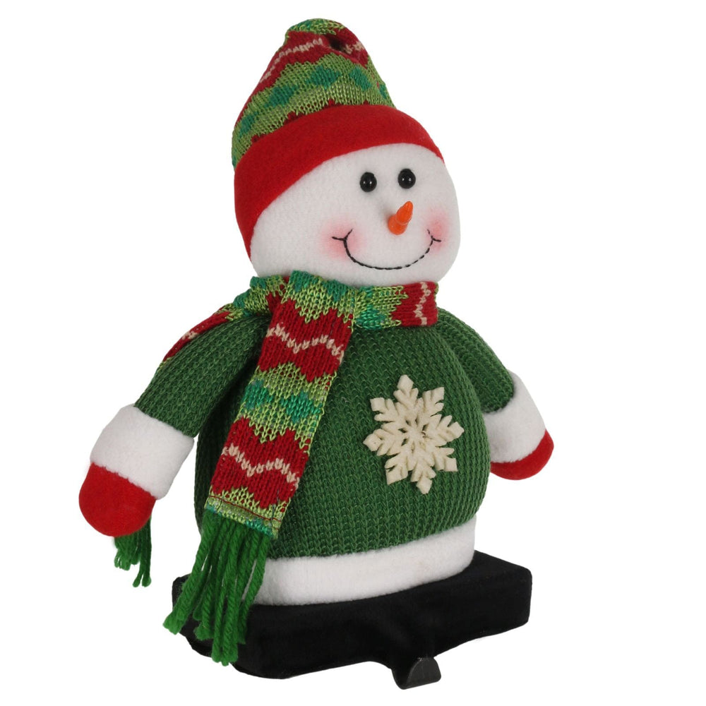 plush snowman figure with green hat and scarf and stocking holder base