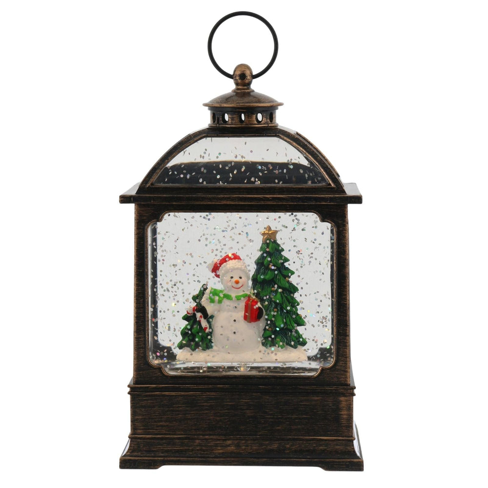 Decorative lantern with a snowman and Christmas tree inside on a white background