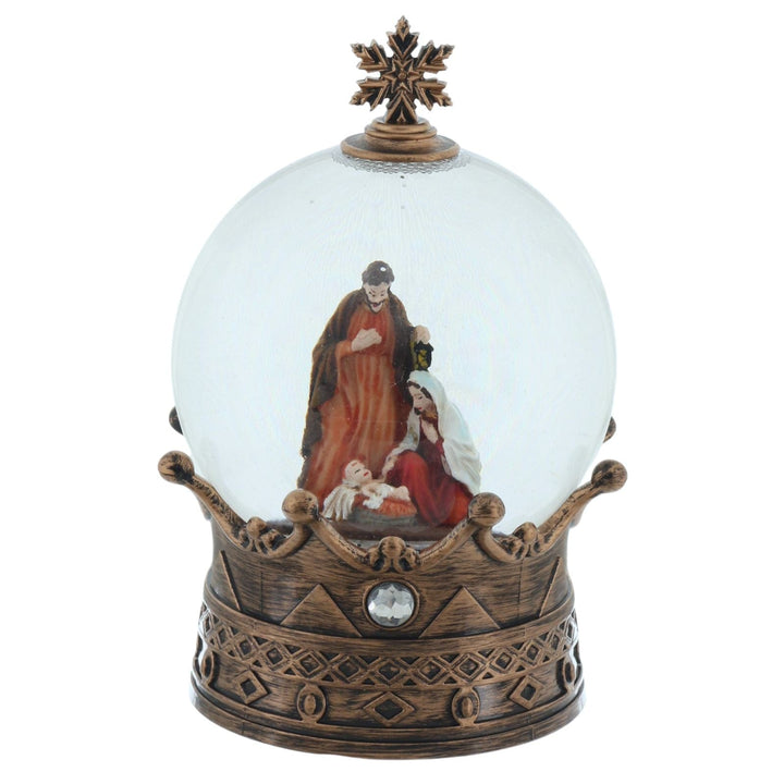 Decorative snow globe with religious scene on a white background
