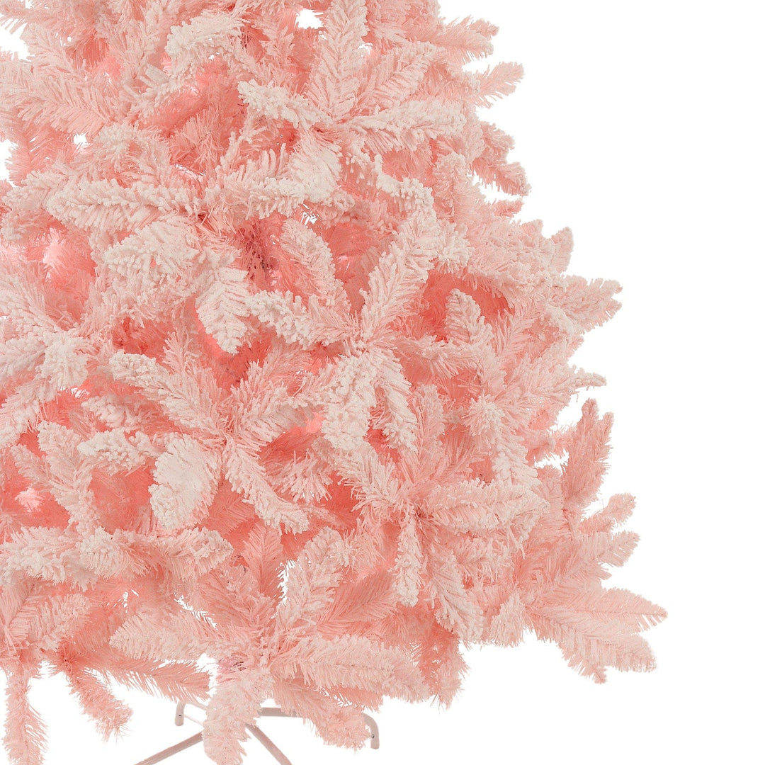 Close-up of a pink artificial Christmas tree on a white background