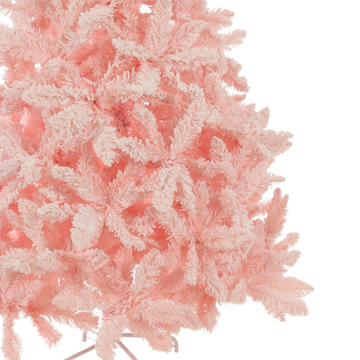 Close-up of a pink artificial Christmas tree on a white background