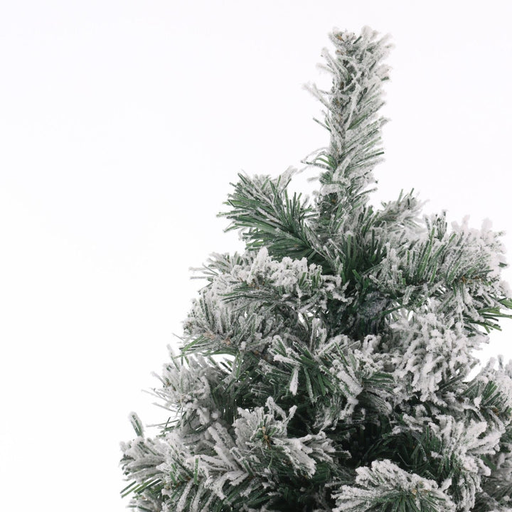 top of flocked artificial Christmas tree on a white background