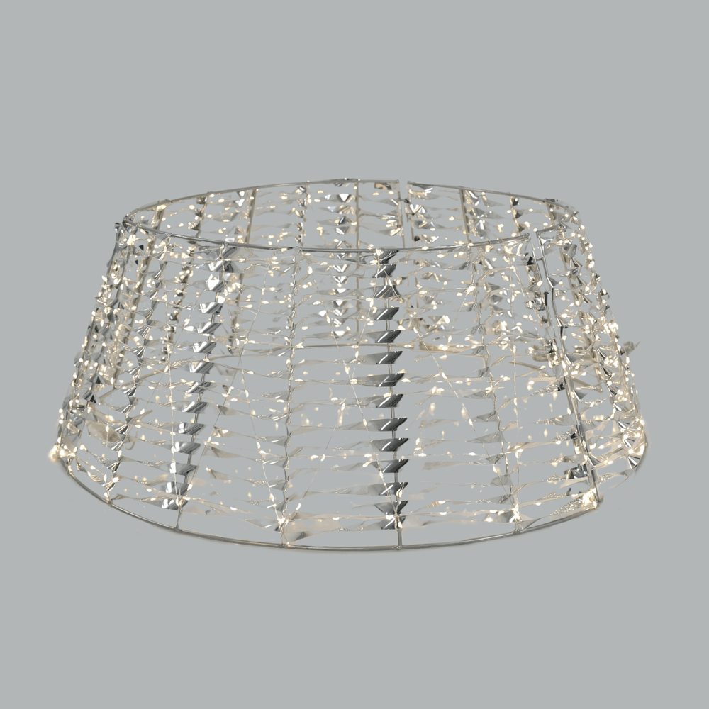 silver tree skirt with warm white copper lights and silver PET material