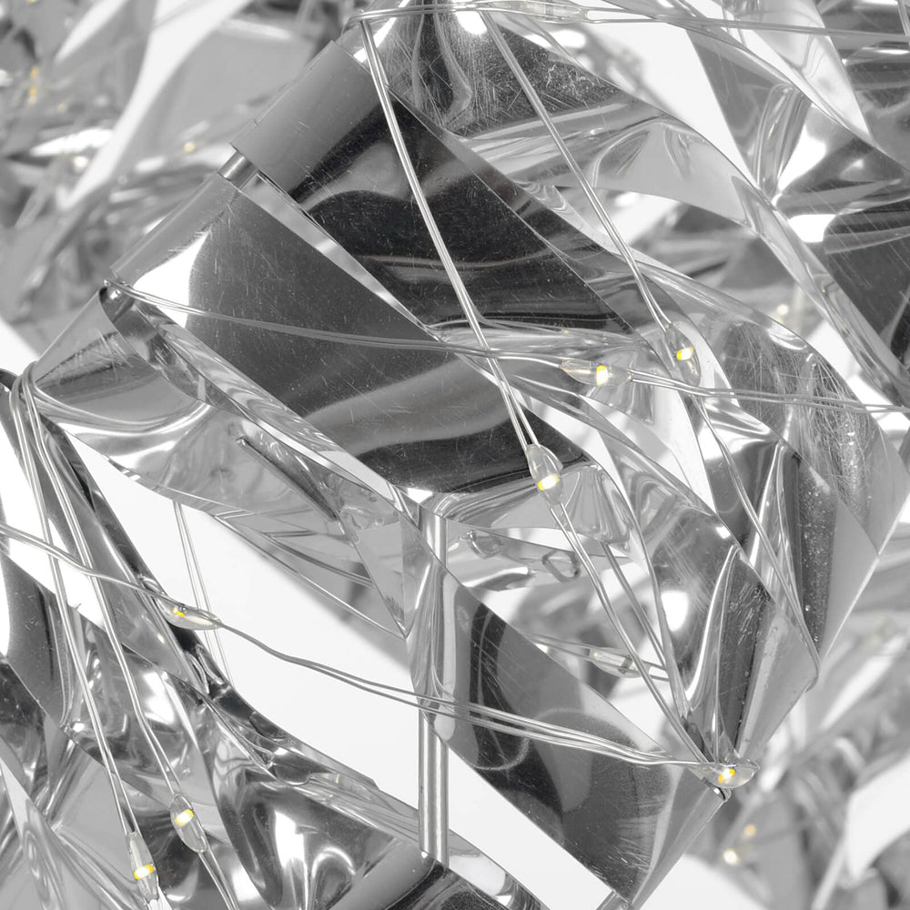 Close up of silver geometric shapes with LED light strings