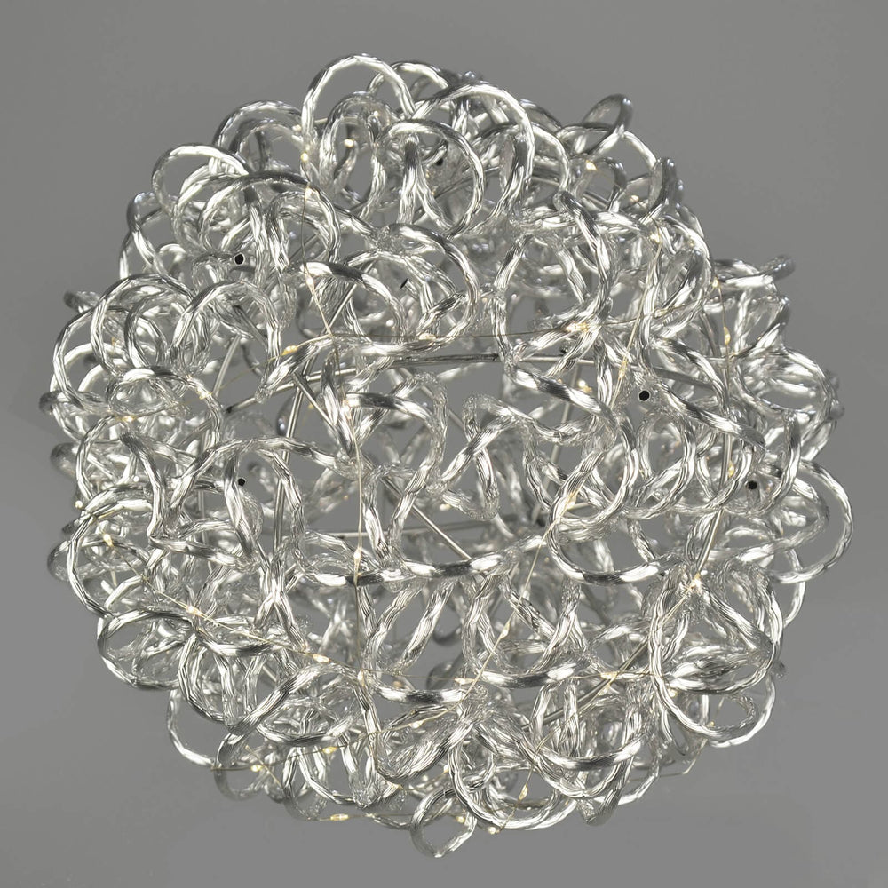 Christmas aluminium ball with LED lights on a grey background