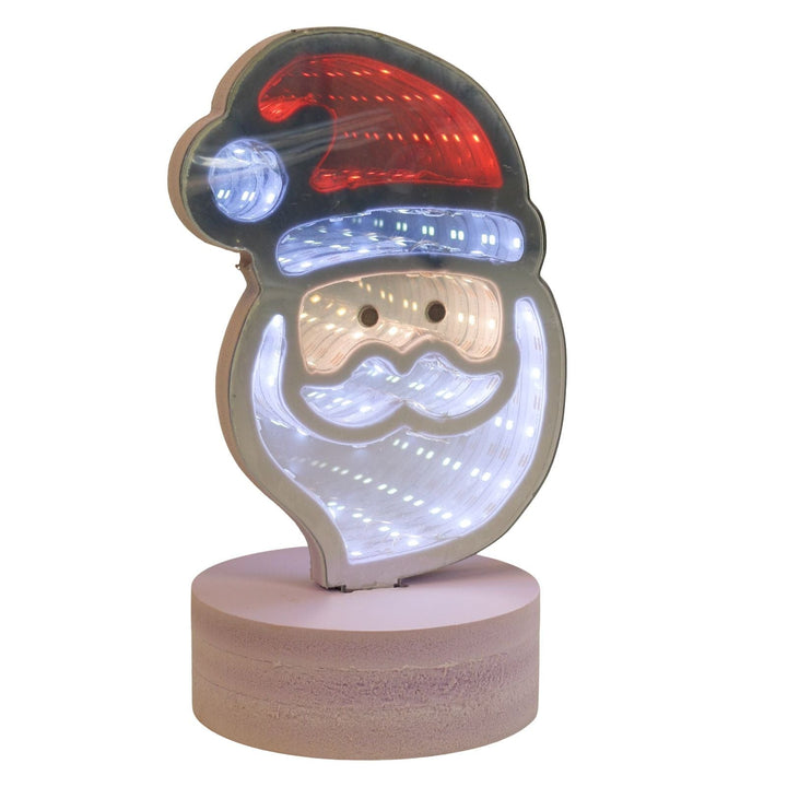 Decorative LED night light shaped like a Santa Claus face on a white background