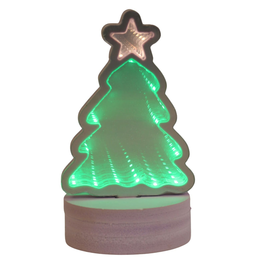 Christmas tree-shaped night light with a star on top, glowing green.
