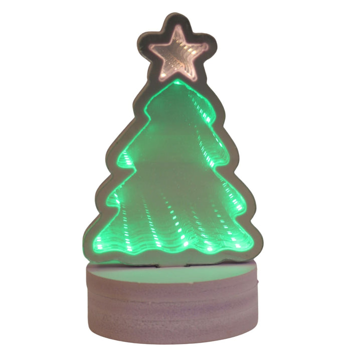 Christmas tree-shaped night light with a star on top, glowing green.