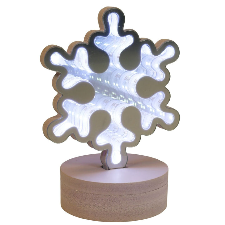Snowflake-shaped night light on a white background