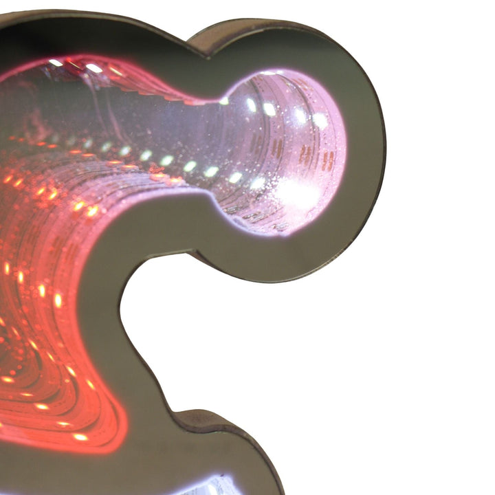 Decorative light shaped like a santa hat with red and white LED lights on a white background