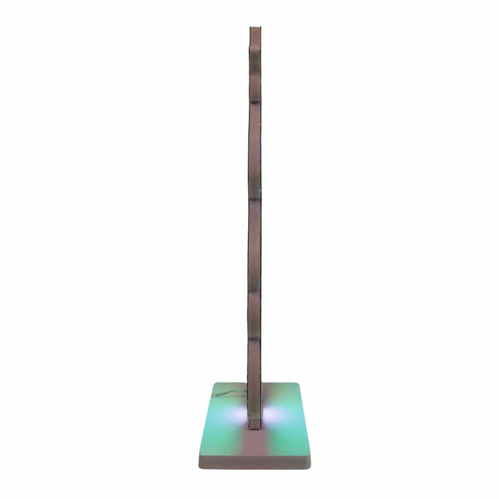 Tall, thin, multicolored lamp on a white background