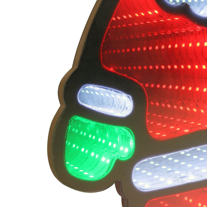 Close-up of a santa light with red, green, and white lights on a white background