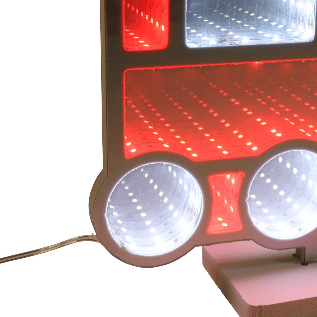 Close-up of train'ss red and white lights on a white background with wire