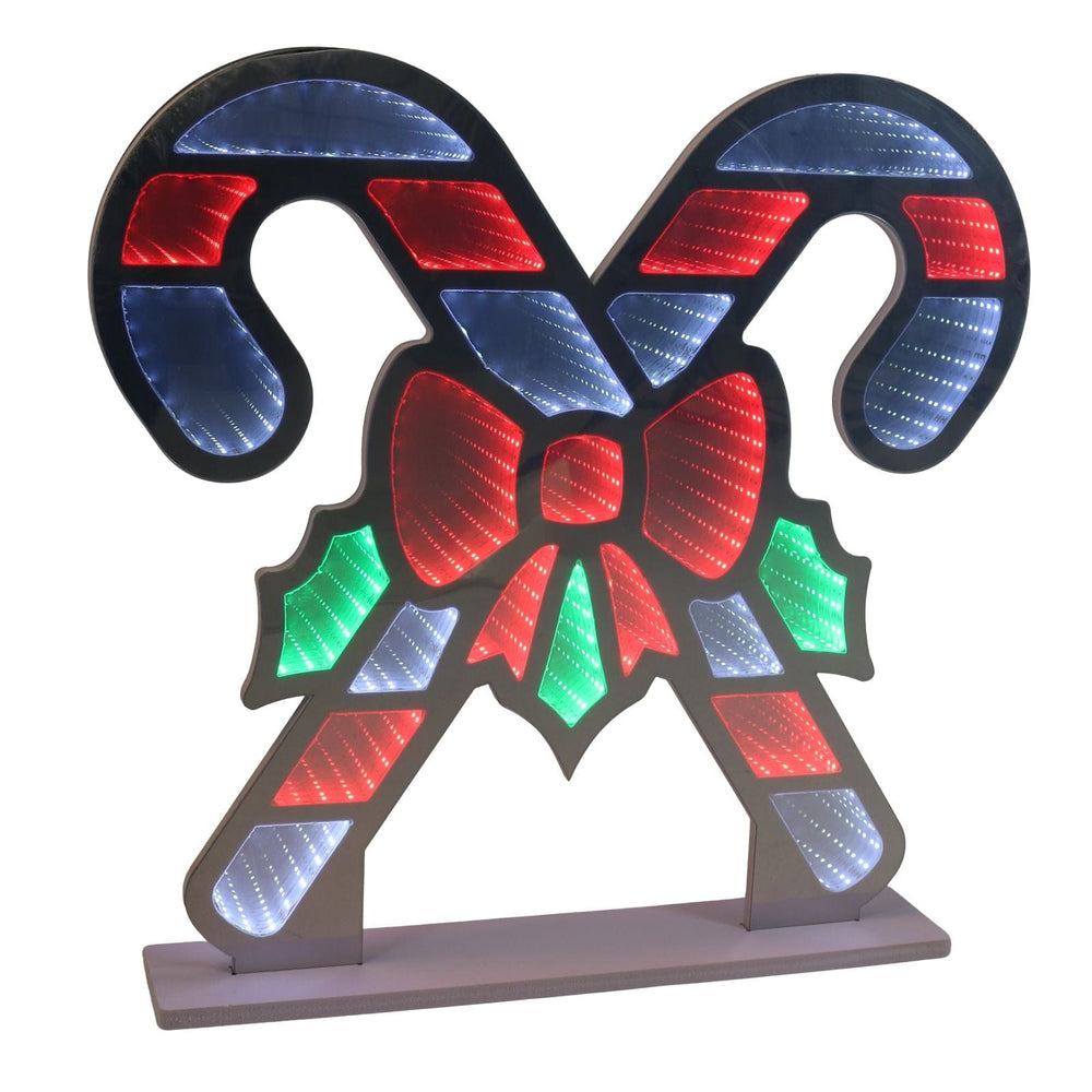 Decorative candy cane with a bow made of colourful lights on a white background