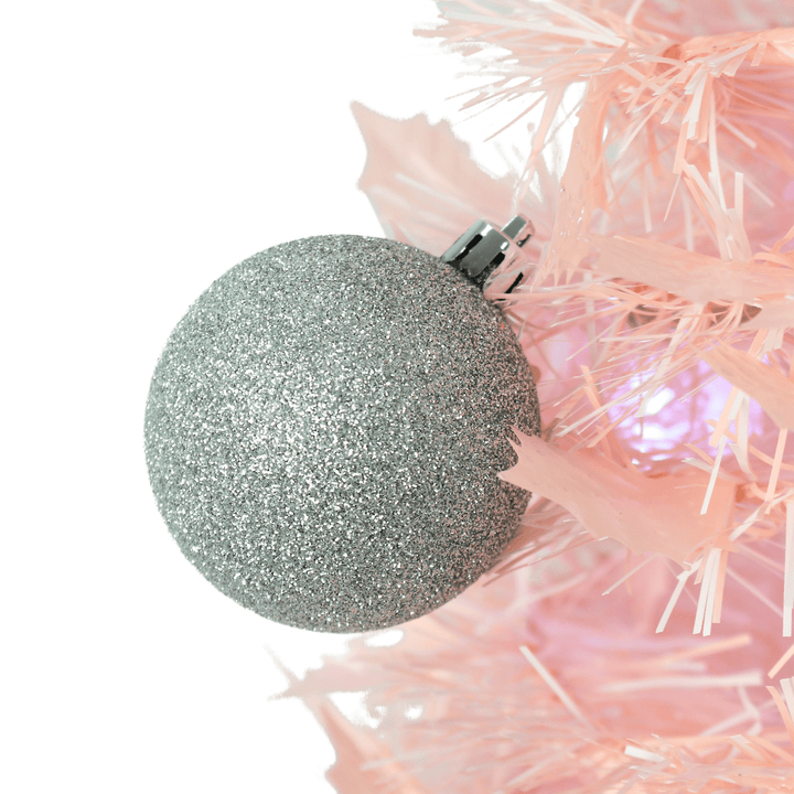 pink tinsel tree with silver glitter bauble