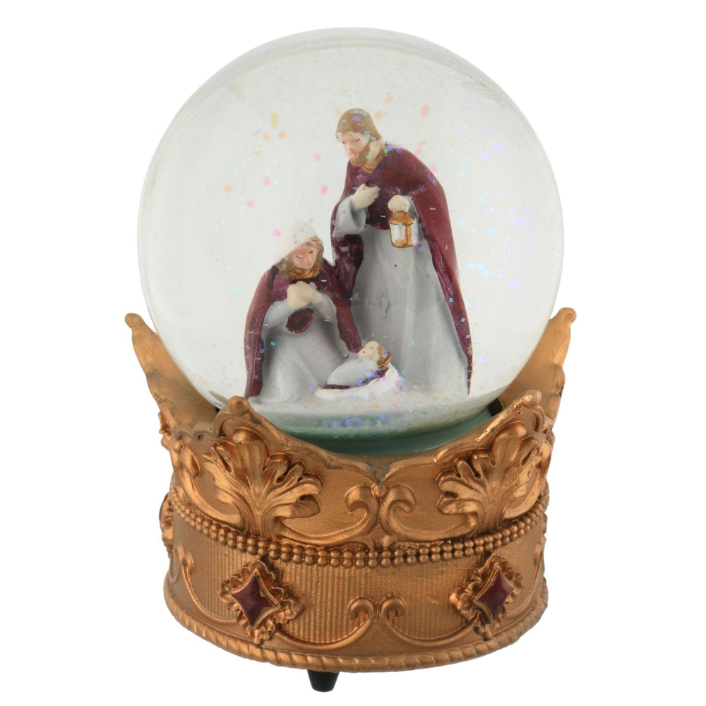 Decorative snow globe with nativity scene on a white background