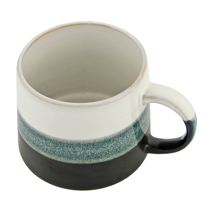 Top down view of a striped glaze stoneware coffee mug