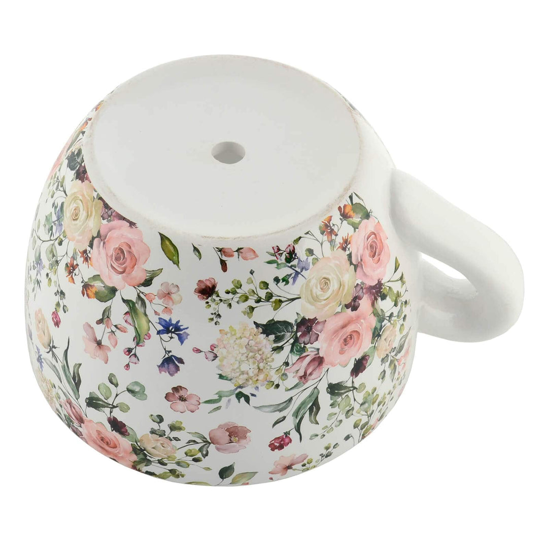 Rose flower teacup planter showing base with drainage hole