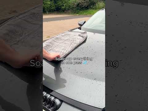 video thumbnail shows car towel being used on a grey car soaking up water droplets