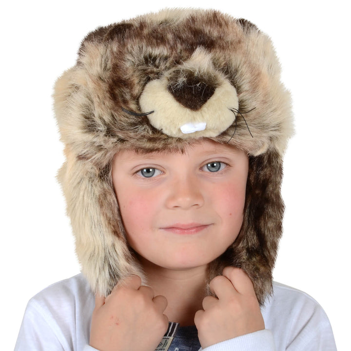 Child wearing a beaver design furry animal hat with ear flaps