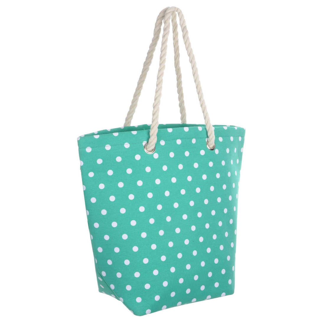 Turquoise green beach bag with white polka dots and rope handles on a white background