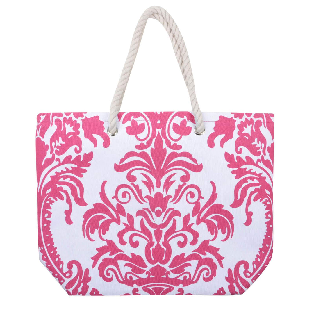 rose pink floral beach bag with white rope handles on a white background