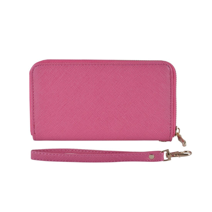 Pink faux leather purse with wrist strap on a white background