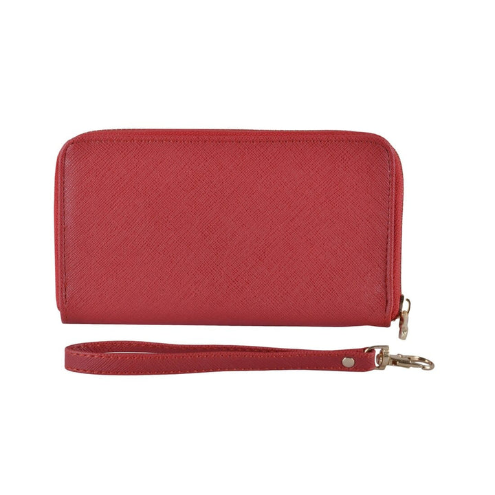 Red faux leather purse with wrist strap on a white background